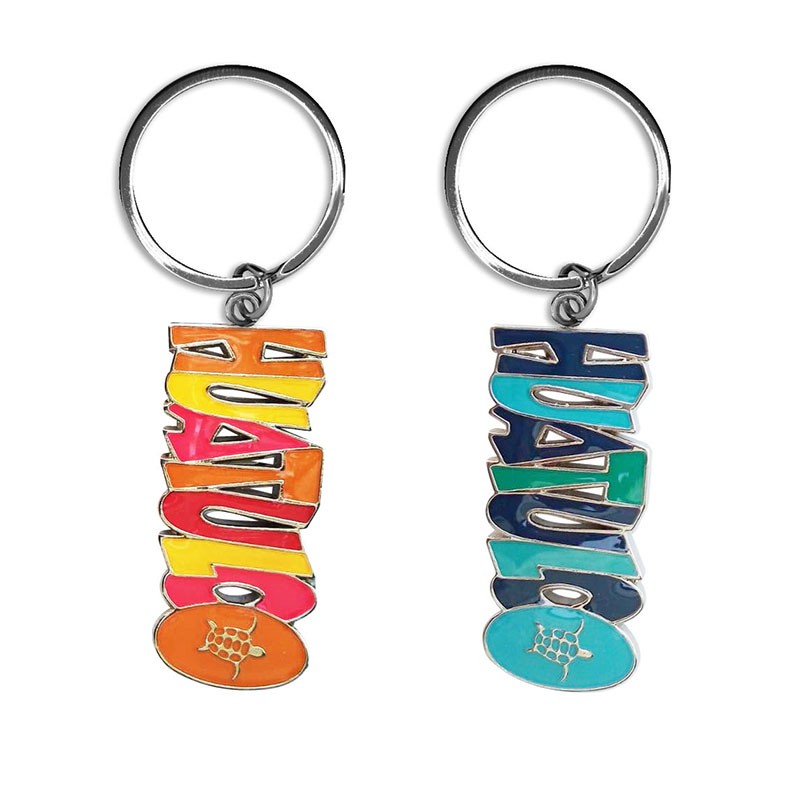 Llavero de metal con el nombre de Huatulco. Souvenir de Huatulco, Mexico