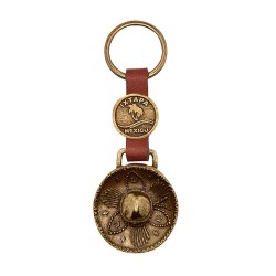 Llavero de latón con la ilustración de un sombrero charro.Souvenir de Ixtapa, México