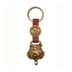 Llavero de latón con la ilustración de una  tortuga. Souvenir de Ixtapa, México