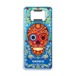 Destapador de metal con una calavera. Souvenir de Oaxaca, México.