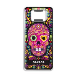 Destapador de metal con una calavera. Souvenir de Oaxaca, México.